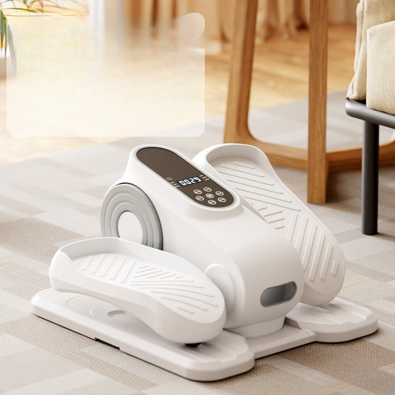 White exercise踏板机 on a bed with a blurred background